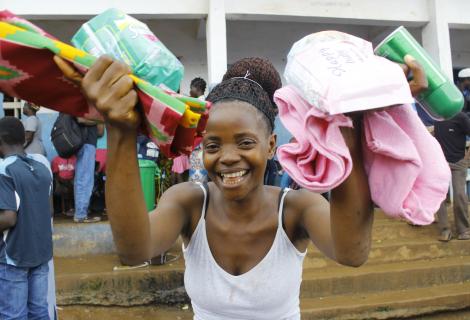 Christiana display her dignity Kits that is supplied by ActionAid