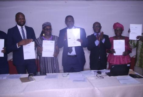 Symbolic launch of the Report and Policy -ActionAid Sierra Leone Executive Director, Policy and Advocacy Manager, BAN, Tax Movement Team Lead, Deputy Minister of Finance 1, CEO bettFirm, Facilitator and Consultant doing symbolic presentation of the report